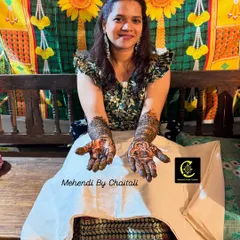 This bride from Malvan is all smiles as she shows off her completed bridal mehendi. It's an honor to be a part of such a joyful day.