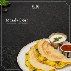 A classic Masala Dosa from our South Indian menu. The crispy crepe is filled with a spiced potato mixture and served with chutney and sambar.