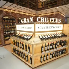 A well-lit shot of the Gran Cru Club's wine selection. We use careful lighting techniques to make products stand out on the shelf, an important aspect of food and beverage photography for retail.