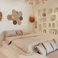 I believe a bedroom should be a personal sanctuary. In this space, I used a neutral palette, natural materials like raffia and woven decor, and unique architectural details like built-in shelving to create a calm, resort-like atmosphere.