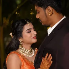 An intimate couple portrait, with the focus on their happy expressions and her flawless makeup.