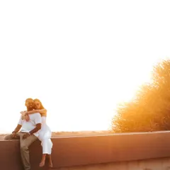 Bathed in the ethereal glow of the golden hour, this wide-angle shot captures a serene moment against the vast, open landscape. It’s about making the world your own private, romantic stage.