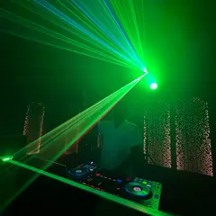The club atmosphere is all about the lights and the bass. Here's a shot of me surrounded by green laser beams, setting the mood for a long night of dancing.