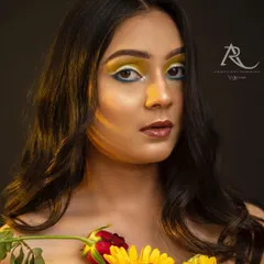 This is where fashion gets playful. Collaborating with a talented makeup artist, we used bold yellow eyeshadow and fresh flowers to create a vibrant, artistic portrait that stands out. It’s a great example of a creative headshot for a model's portfolio.