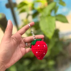 A sweet little strawberry keychain, perfect for adding a fruity touch to your keys or bag.