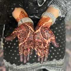 A close-up of the beautiful dark stain from a floral henna design. I love how the rich color makes the intricate details of the roses and leaves stand out.