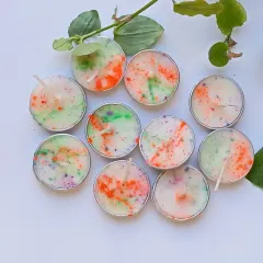 The colors of joy. These peach-scented soy wax tealights are a fun and eco-friendly way to decorate your home for the Holi festival.