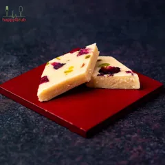 Our Kaju Katli is made with the finest cashews, blended with the freshness of rose petals. This classic Indian sweet simply melts in your mouth.