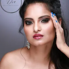A classy cocktail look. This features a dark, sultry smoky eye with a glossy lip, paired with voluminous hair for a look that is ready for any glamorous party.