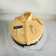 My uniform cakes are very popular. This one is a police uniform for Harpreet Kaur, created with sharp details and minimal use of fondant.
