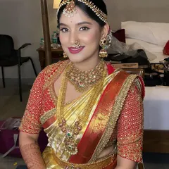 The complete bridal look, with a traditional hairstyle adorned with fresh flowers and a radiant smile. This is the timeless grace I strive to create for every South Indian bride.
