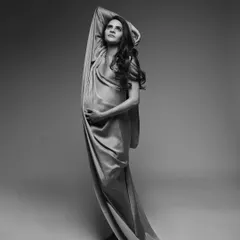 I love creating bold, artistic poses with fabric draping. This black and white image showcases the strength and grace of motherhood in a single, powerful frame.
