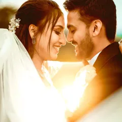 The golden hour light adds a magical glow to this intimate moment from a Christian wedding. I focus on capturing the genuine smiles and connection between the couple, creating a timeless and romantic portrait.