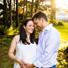 The connection between a couple is what makes a maternity shoot so special. This photo, taken in a beautiful botanical garden, is all about their shared joy and anticipation.