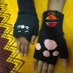 Adorable and practical cat-paw fingerless gloves, perfect for keeping hands warm while leaving fingers free to play. The design features a cute cat face on one glove and paw prints on the other.