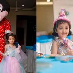 Look who came to the party! A little girl poses with a Minnie Mouse mascot, a perfect addition to any Disney-themed birthday celebration. These interactions make for fantastic photo opportunities.