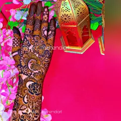 A designer henna piece on my own hand, featuring a mix of bold florals and delicate shading.