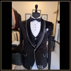 This black velvet tuxedo features elegant white piping along the lapels and pockets, adding a subtle yet striking contrast to the classic silhouette.
