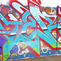 A high-energy wildstyle piece in red and blue, showcasing sharp, aggressive letterforms and my UFO crew tag. This style is perfect for making a bold statement.