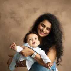A playful moment, with mom lifting her baby up as if in flight. These interactive shots result in the most natural smiles and laughter.