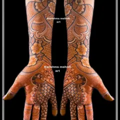 This is a perfect example of intricate mehendi for guests, often called 'siders work'. This design features symmetrical peacocks and detailed patterns, offering a rich, full-hand look for bridesmaids and close family.