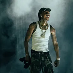 Wiz Khalifa smiles, lost in the moment amidst a cloud of atmospheric smoke at Rolling Loud India. This is the kind of candid shot I live for, capturing the genuine connection between an artist and their music.