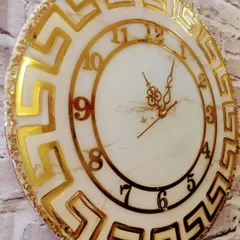 For those who love a touch of luxury, this gorgeous marble effect clock with a golden Versace-inspired design is a statement piece. It's handmade with love and ready to adorn a new wall.