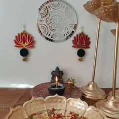 My Kamal (lotus) wall hangings are a symbol of purity and beauty. This pair in pink and black adds an elegant touch to any wall.