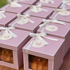 A collection of our baby announcement gift boxes, all lined up and ready to be shared. The consistent and charming presentation makes for a memorable announcement.