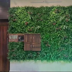 A completed artificial green wall installation for a bungalow porch. This premium, dense foliage wall creates a stunning maintenance-free entrance and integrates seamlessly with the home's architecture, including a custom cutout for the letterbox.