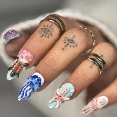 Your nails are my canvas. This set features incredibly detailed, hand-sculpted 3D marine life, including a sea turtle, jellyfish, and starfish, bringing a vibrant underwater world to your fingertips.