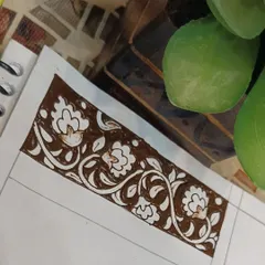 A practice sketch of a beautiful floral border. This type of design is versatile and can be used for festivals or as part of a larger bridal piece.