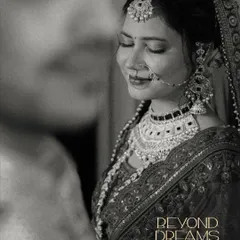 A timeless black and white portrait of the bride, capturing a moment of quiet reflection and her "Beyond Dreams" glow.