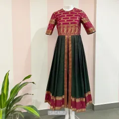 The final creation: a beautiful dress made from a repurposed Kanjeevaram saree, featuring the original border on the bodice, hem, and center panel.