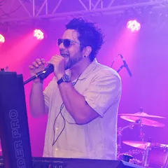 Johaan at the keyboard during a high-energy set for a brand event. We bring the same passion and professionalism whether we're on a festival stage or at a corporate gala.