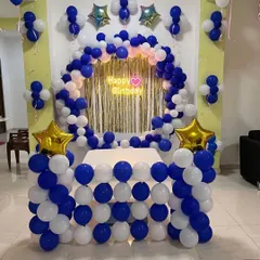 A similar blue and white cake table decoration, this time with a gold foil curtain backdrop.