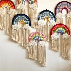 My macramé rainbow wall hangings are one of the most popular ways to bring a pop of color and joy into a room. This image shows just a few of the many color combinations I can create, each featuring fluffy, hand-knotted clouds and soft fringe.