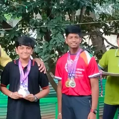 The joy of achievement. Two of our junior shooters celebrate their wins, showcasing the results of their hard work and the supportive environment we foster at the academy.