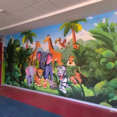 A full view of the jungle animal mural in a hallway, turning a simple passage into a delightful experience for kids.