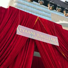 A closer look at the grand red velvet entrance for the Ajio Luxe WKND event. The sheer scale of the drapery, combined with professional stage lighting, created a powerful and glamorous entryway for the fashion showcase.