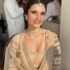 A happy, sun-kissed portrait of my bride, Zara. Her makeup is fresh, minimal, and radiant, letting her natural beauty shine through for her daytime Anand Karaj ceremony.