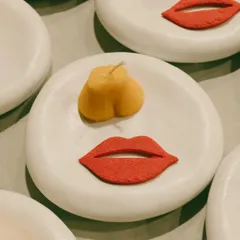 Playful butter molds shaped like lips and bottoms, created for a fun and cheeky 30th birthday dinner. These little details are what make an event memorable and personal.