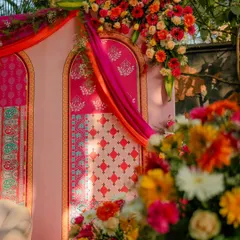 A closer look at the rich textures and patterns. We layered different block prints in shades of pink and orange, accented with lush floral arrangements.