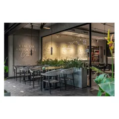 By opening up the glazing and surrounding the café with lush plants, we created a seamless indoor-outdoor connection. This design reflects the brand's story of connection, creating the perfect spot to unwind and connect with others.