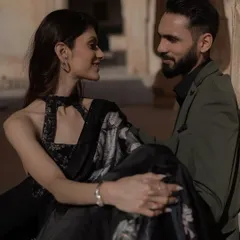 The look of love, captured in a candid moment during a royal pre-wedding shoot. The soft light and historic setting add a layer of timeless romance to this beautiful portrait.