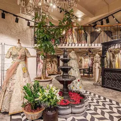 This wider view showcases the full scope of the spatial transformation, including the mezzanine level. Our design created a dynamic, multi-layered retail experience within the 1400 sq.ft. space, balancing open areas with more intimate corners for browsing.