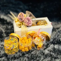 A curated Rakhi hamper featuring jars of our gourmet snacks and a beautifully decorated gift box. It's a perfect blend of traditional gifting with a modern, delicious twist.