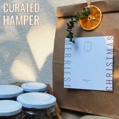 A close-up of our curated Christmas hamper bag. The simple, elegant packaging is designed to let the thoughtful gifts inside shine.