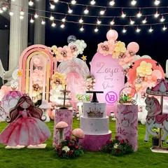 A stunning outdoor princess-themed first birthday party. This setup shows how we can create a grand and magical atmosphere in a garden setting with props, lighting, and detailed decor.