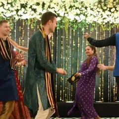 I specialize in bringing people together, no matter where they come from. Here I am, leading a dance segment at a vibrant Maharashtrian-German wedding, ensuring that guests from different cultures connect, laugh, and share the dance floor in a celebration of unity and love.